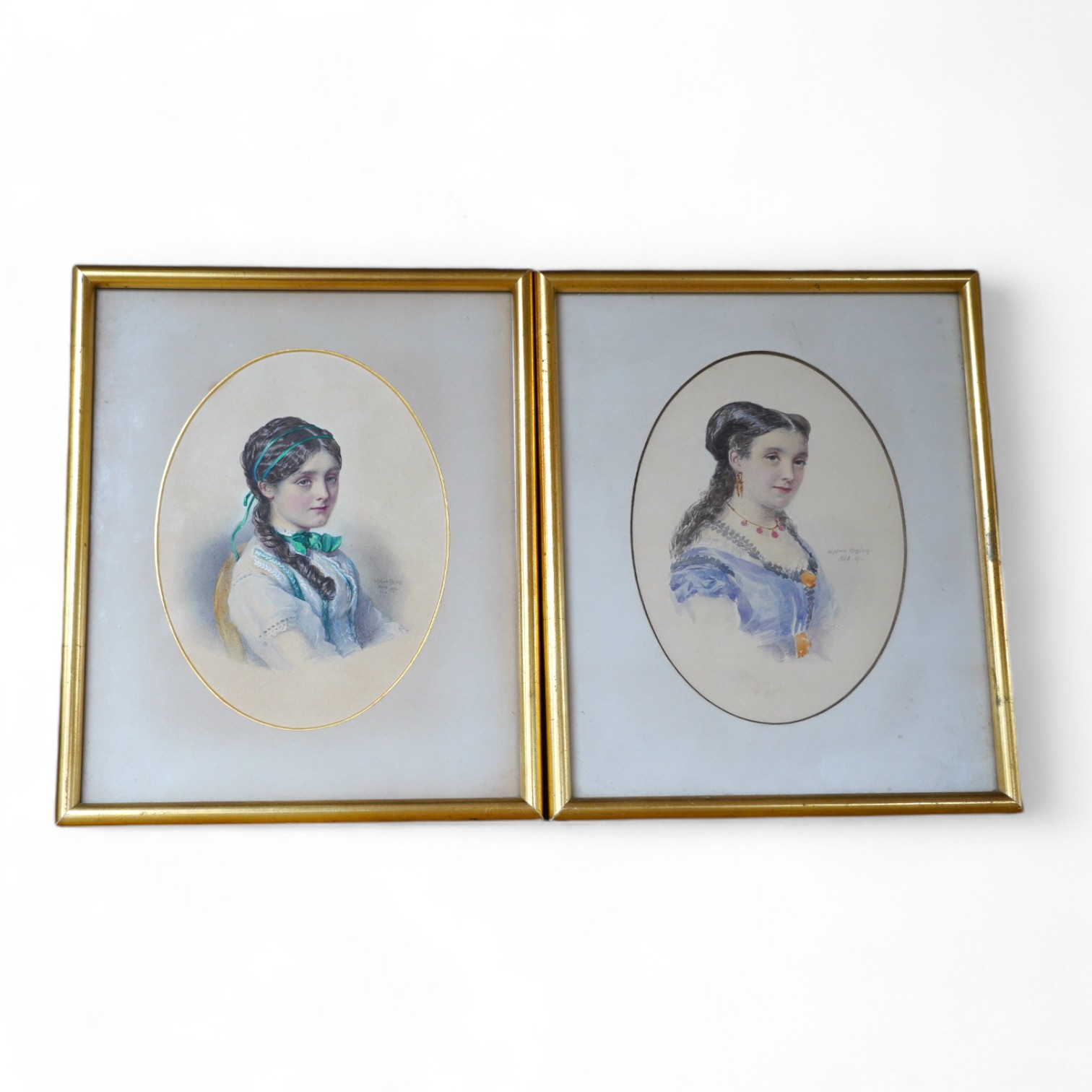 William Egley (1798-1870), oval watercolour, Portrait of a lady, signed and dated 1870, together with another work in the manner of Egley, bears signature and date 1868, 20 x 14cm. Condition - fair